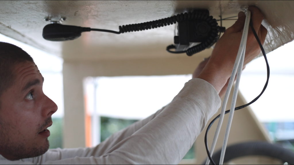 Walter from salty electric installing wires for radio